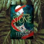 The Damning Stone by T.J. Klune Cover overlaid on a generic plant leaf background